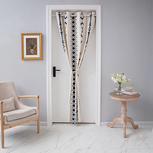 Bohemian geometric door curtain in cream fabric with navy blue diamond patterns
