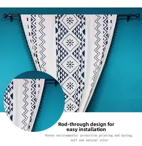 Detail of rod pocket bohemian curtain with blue geometric prints and black tassels