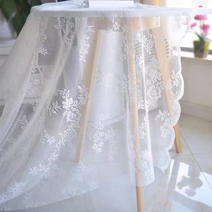 White French hollow lace tablecloth with delicate floral embroidery and scalloped edges