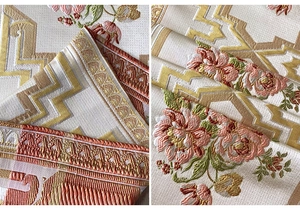 Detail of embroidered floral patterns on luxury chenille fabric for table runners
