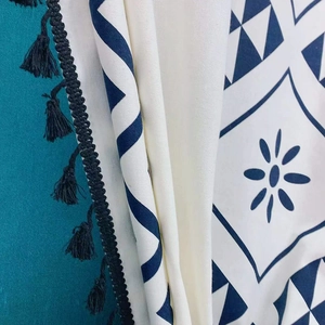 Bohemian cream cotton linen curtain with navy blue geometric prints and tassel trim details