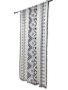 Bohemian cotton linen curtain with navy geometric prints and fringe on white background