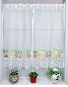 Detail of white lace cafe curtains with vibrant strawberry and lemon fruit prints