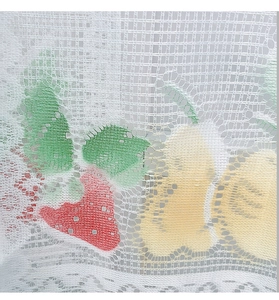 Macro view of white warp-knitted lace fabric featuring colorful strawberry and fruit patterns