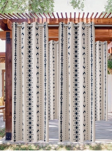 Detail of waterproof Bohemian curtain with blue geometric patterns and metal grommets