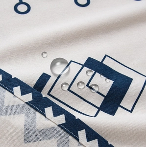 Detailed close-up showing waterproof water droplets on bohemian print cotton linen fabric