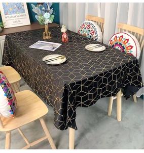 Macro detail of dark velvet tablecloth with luxury gold geometric lines and thick texture
