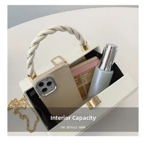 Detailed interior view of a white quilted crossbody bag showing spacious capacity for items