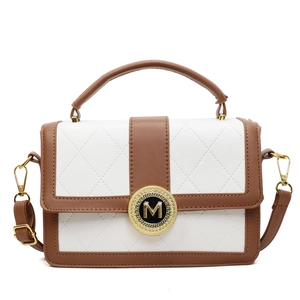 Elegant white quilted leather tote bag with brown handles and golden M buckle logo