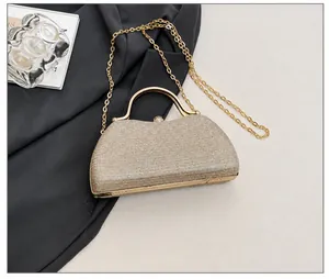 Detail showing evening bag capacity with smartphone comparison and gold chain strap
