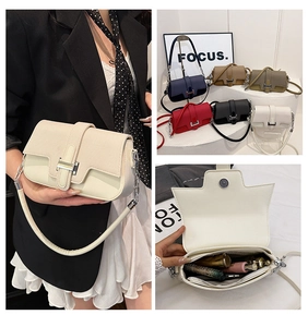 Detailed interior view of a minimalist crossbody bag showing storage for makeup items