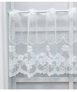 Detailed view of white lace cafe curtain with delicate floral crochet and scalloped edge