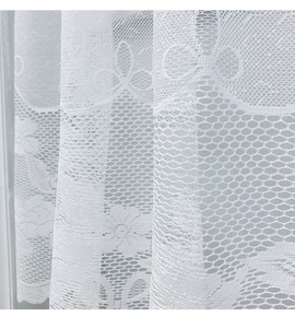 Detail shot of white lace floral pattern and hexagonal mesh fabric for cafe curtains