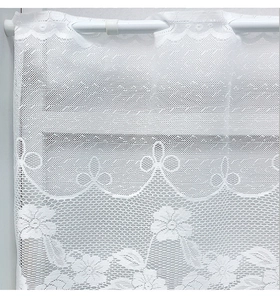 Detail of white lace cafe curtain with floral embroidery and rod pocket header