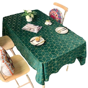 Dark green velvet tablecloth with golden geometric patterns for elegant dining home decor