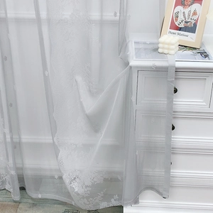 White lace embroidered curtain with floral patterns and scalloped edges for bedroom