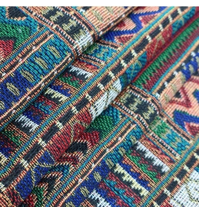 Close-up of bohemian jacquard table runner showing colorful geometric weaving texture