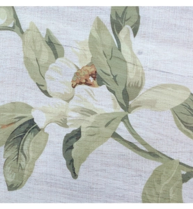 Detail of floral printed linen tablecloth with vintage green leaves and cotton texture