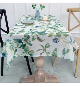 Close-up of rustic floral print on linen table cloth showing fabric texture and detail