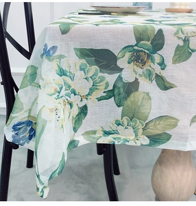 Close-up of floral linen tablecloth showing thick texture and fresh botanical prints