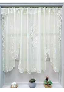 Detail of white lace Roman curtain with floral rose embroidery and scalloped edges