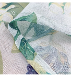 Macro detail of high-density floral mesh fabric with white stitched overlock edge finish