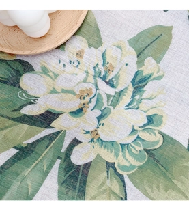 Detail shot of country style floral print on linen textured rectangular tablecloth