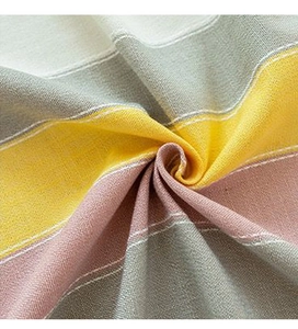 Detail of striped cotton linen fabric showing grey yellow pink pattern and texture
