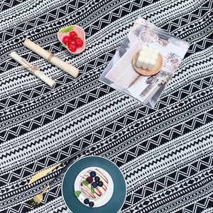 Bohemian black and white geometric picnic mat styled with outdoor leisure accessories