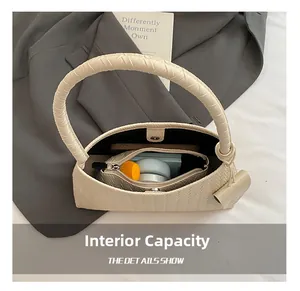 Top view of cream woven bucket bag showing spacious interior with cosmetics and wallet