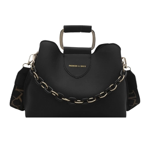 Black pebbled leather tote with metal handle, gold chain decor and patterned shoulder strap