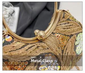 Detailed macro of the gold metal clasp and sequins on the elegant evening clutch bag