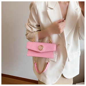Detailed view of pink mini handbag featuring woven pattern and gold M buckle accent