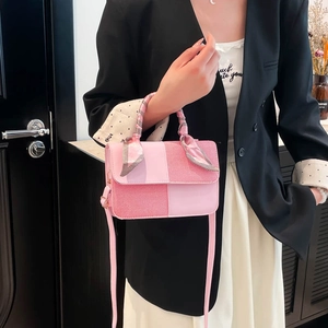 Pink patchwork crossbody bag with silk scarf handle detail and adjustable strap