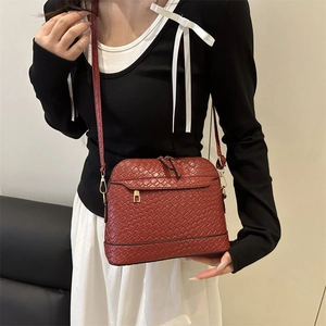 Deep red woven crossbody shell bag for women with gold zipper and adjustable strap
