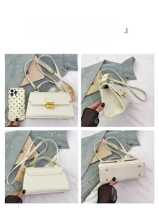 Detailed views of white lychee leather handbag showing golden lock and base studs