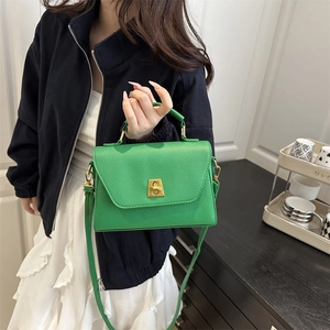 Chic green lychee texture leather satchel with golden twist lock and top handle