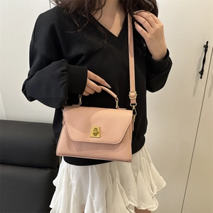 Pink lychee grain crossbody bag for women with gold twist lock and adjustable strap