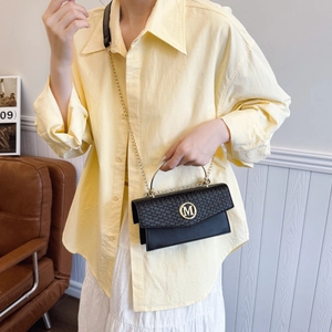 Black woven texture mini crossbody bag with gold M hardware and metallic handle