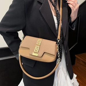 Brown saddle bag with Greek key gold lock and adjustable strap for women