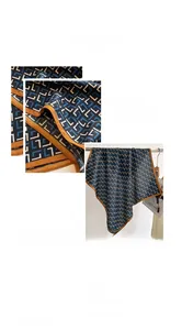 Détail d'un foulard en soie polyester 68x68cm avec motifs géométriques et taille