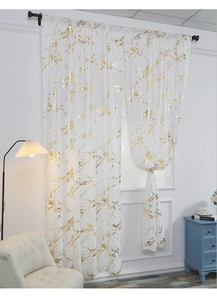 Detail of white velvet curtain with gold marble foil print on a black metal rod