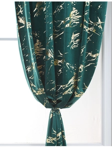 Detail of dark green velvet curtain with gold marble texture and metallic foil print