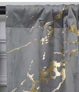 Detail showing gold foil marble pattern on velvet fabric for grey blackout curtains