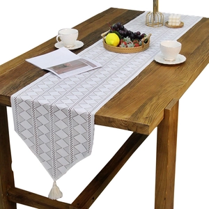 Nordic white lace table runner with grey geometric diamond patterns and tassels