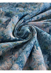 Macro shot of blue and white floral jacquard fabric with premium woven texture detail