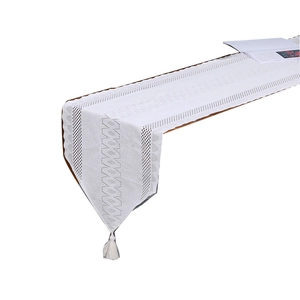 White French lace table runner with geometric hollow patterns and hanging tassels