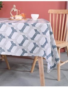 Close-up of geometric honeycomb pattern tablecloth in blue and grey cotton linen fabric