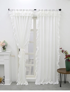 Detail of white velvet curtain featuring elegant ruffled edges and premium draped texture