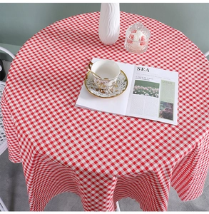Detail of red and white checkered linen tablecloth showing soft texture and drape